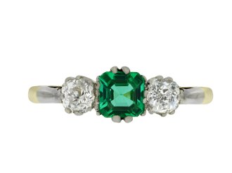 Emerald and diamond three stone ring