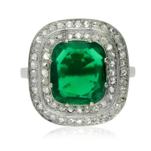 Emerald and diamond cluster ring, circa 1920.