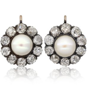 Victorian pearl and diamond cluster earrings, circa 1880.