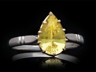Yellow Ceylon sapphire solitaire ring, circa 1960. Hatton Garden