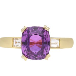 Purple sapphire and diamond flank solitaire ring, circa 1980.